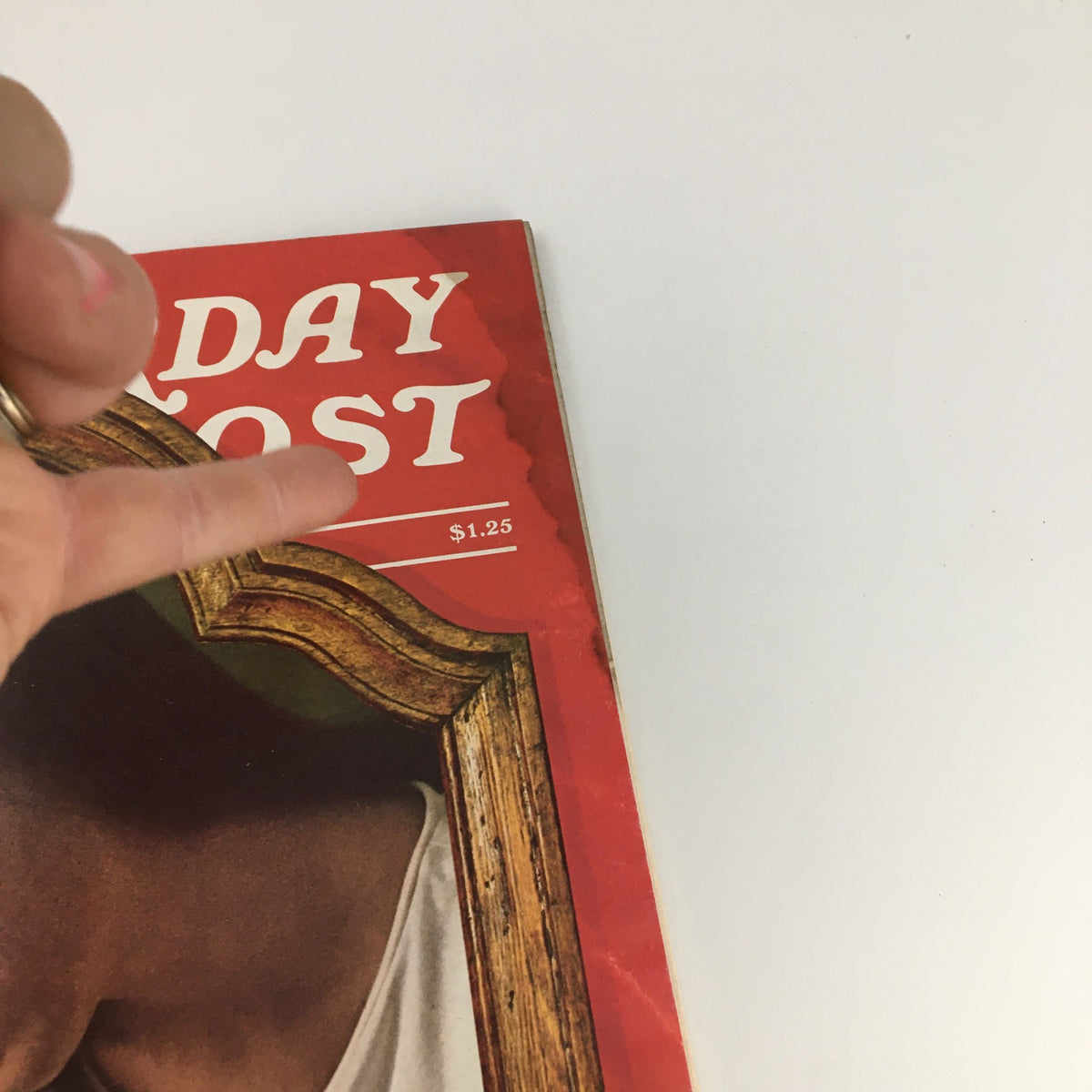 Close-up of the top section of The Saturday Evening Post December 1974 cover showcasing the magazine's name and price of $1.25.