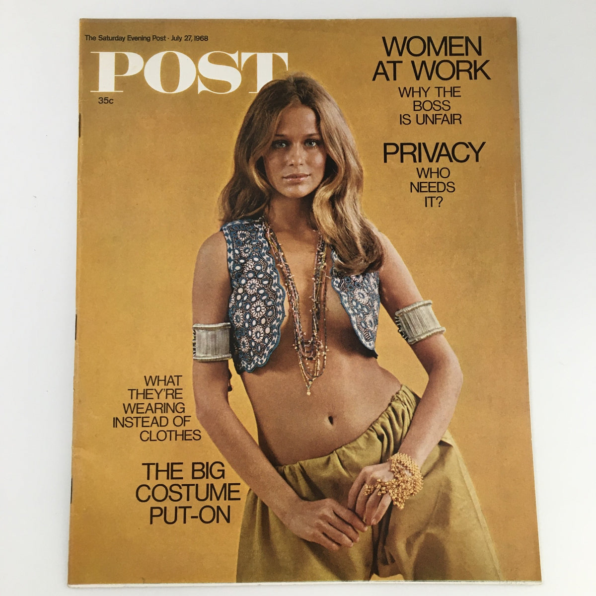 The Saturday Evening Post July 27, 1968 cover featuring Lauren Hutton, showcasing fashion trends of the 1960s with a model wearing a stylish outfit highlighted by a cropped vest and flowing skirt, addressing cultural topics like women at work and privacy.