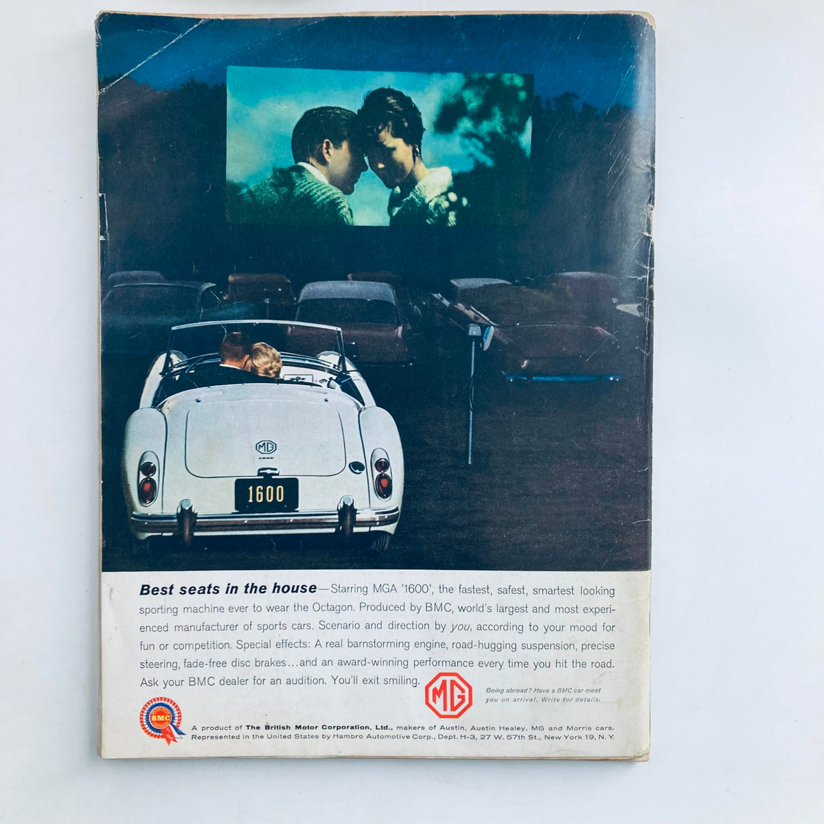 Back cover of VTG Playboy Magazine January 1961 featuring a vintage advertisement for a car with a couple enjoying a drive-in movie.