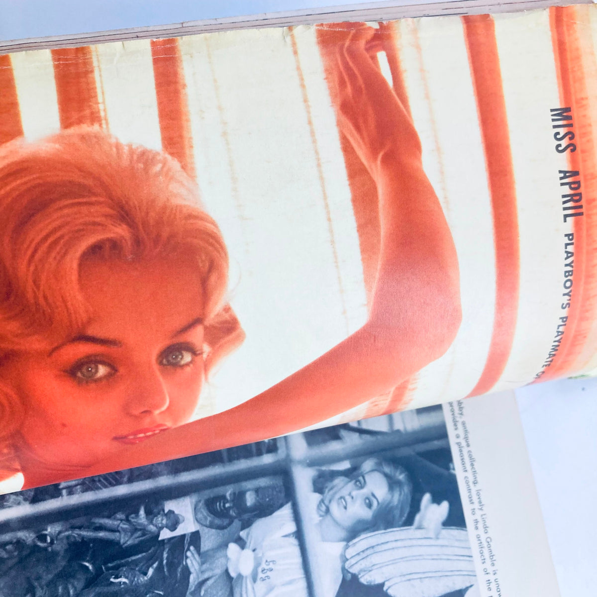 Cover image of VTG Playboy Magazine April 1960 featuring Linda Gamble as Miss April, showcasing her beauty with vintage stripes in the background.