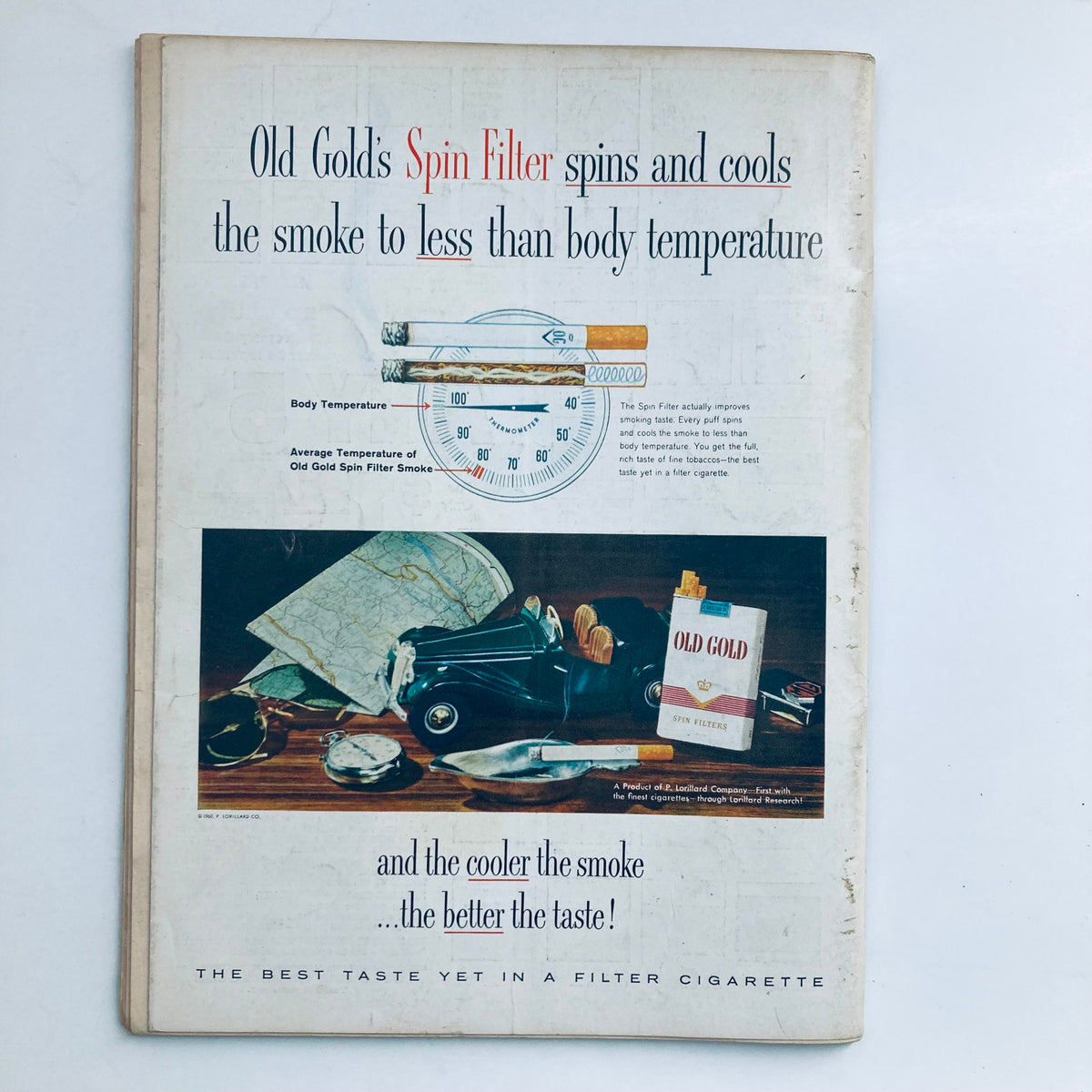 Back cover of the VTG Playboy Magazine April 1960, featuring an advertisement for Old Gold Spin Filter cigarettes with an image of a car, map, and cigarette pack, reflecting the style of the era.