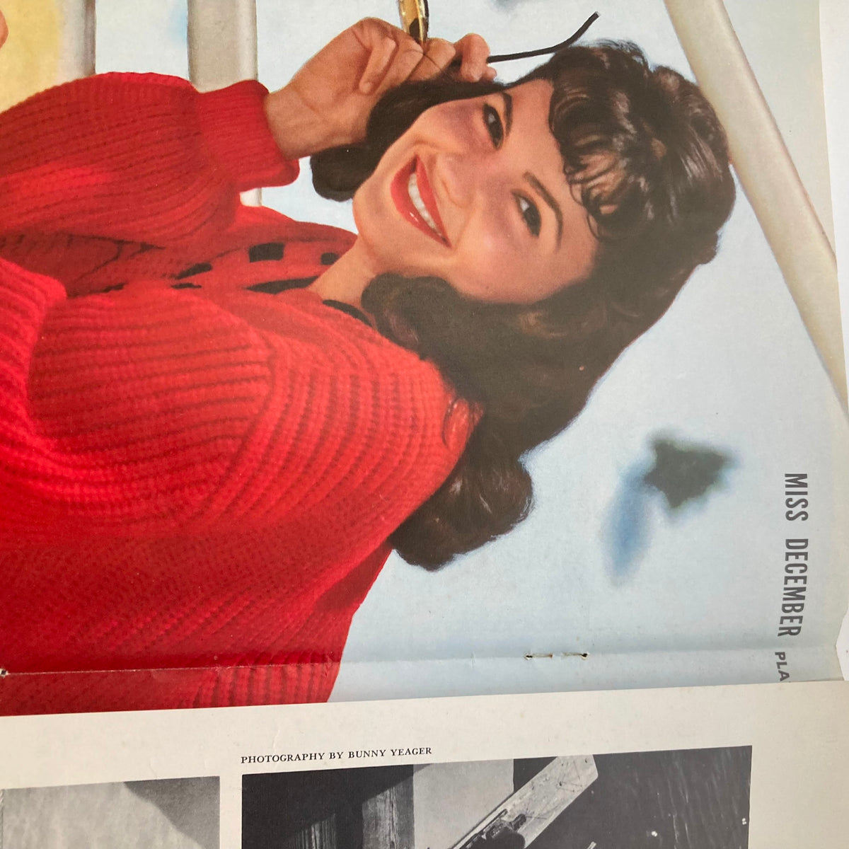 VTG Playboy Magazine December 1958 featuring Joyce Nizzari, smiling and posing in a red sweater. Iconic vintage photography from the magazine's centerfold.