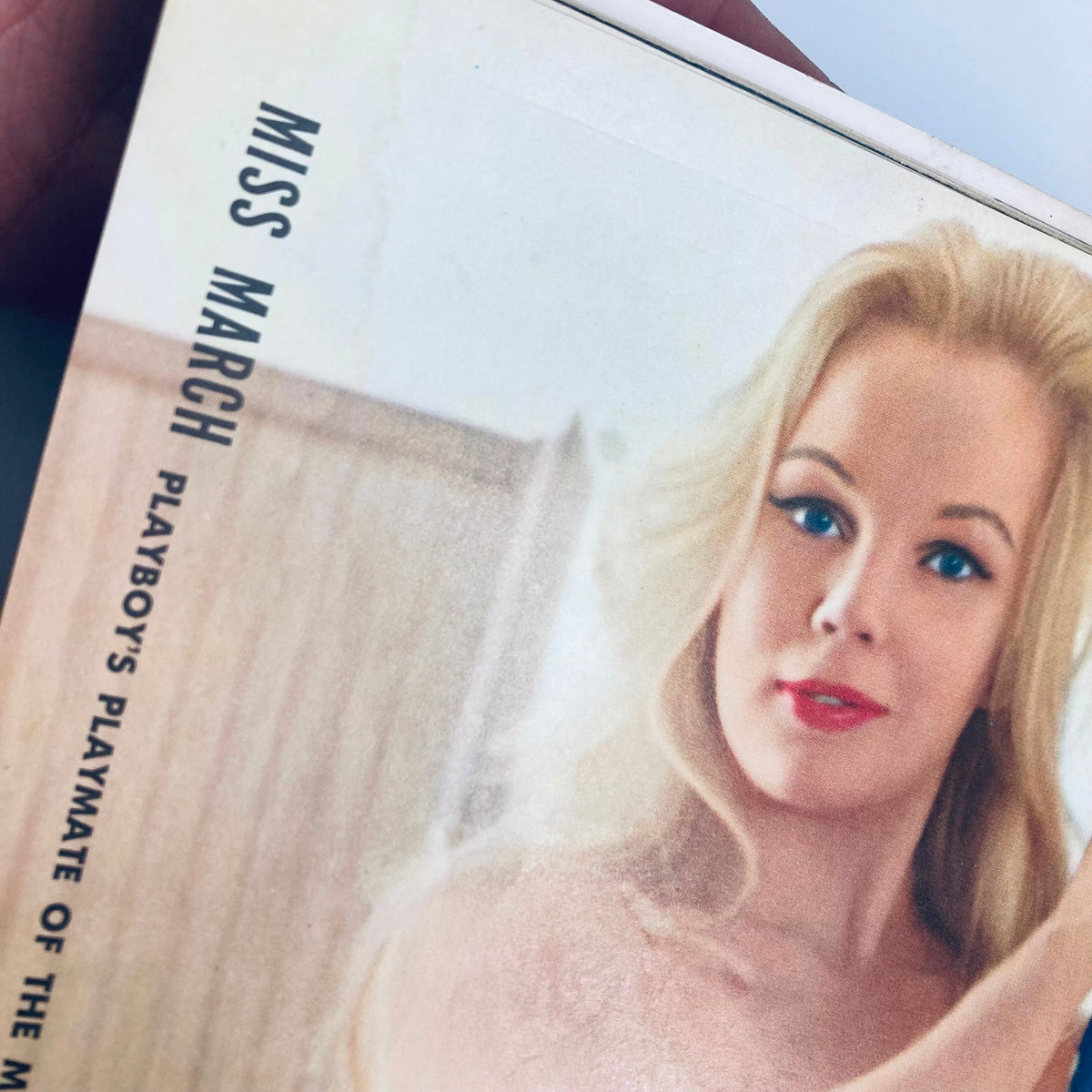 Close-up of the cover of VTG Playboy Magazine March 1960 featuring Playmate Sally Sarell, highlighting the title 'Miss March' and her captivating image.