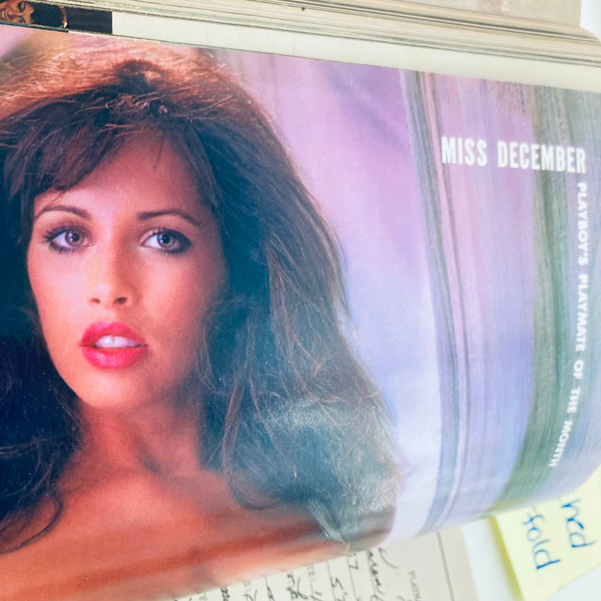 Inside page of VTG Playboy Magazine December 1984, featuring the Playmate of the Month, showcasing her beauty and allure.