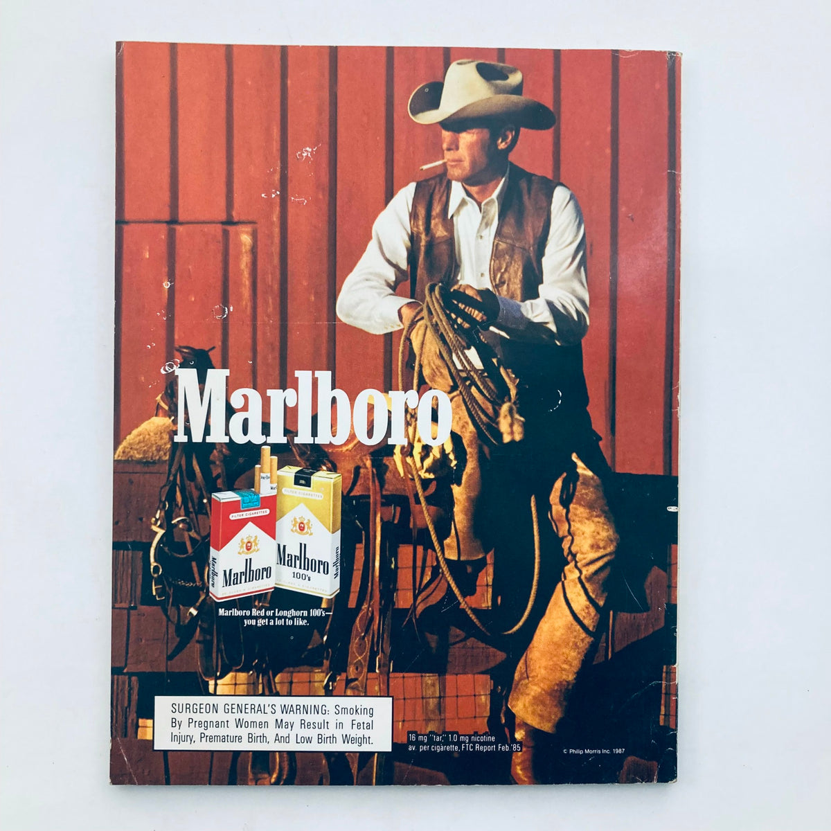 Back cover of the VTG Playboy Magazine September 1987 featuring a vintage Marlboro advertisement with a cowboy theme.