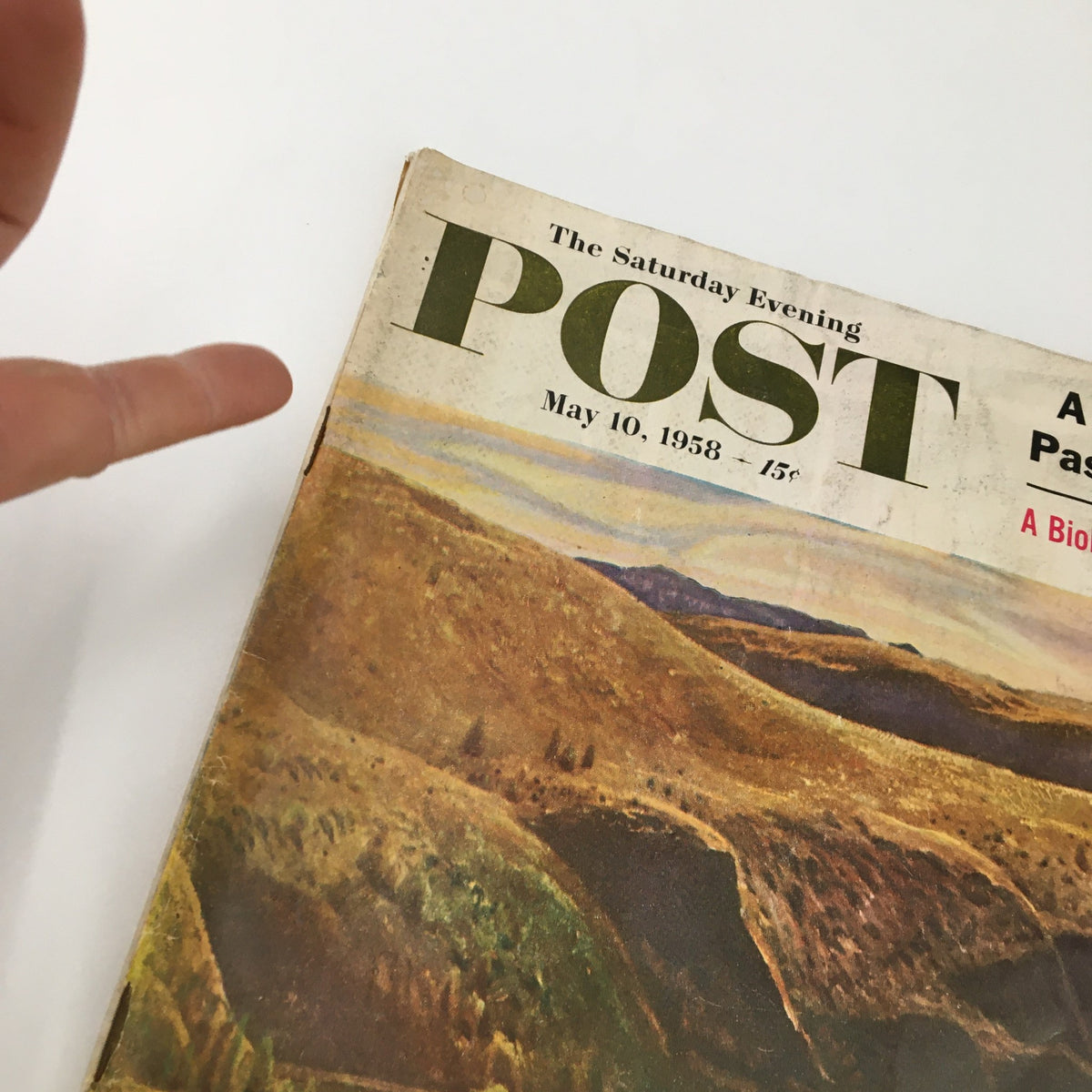 Close-up view of The Saturday Evening Post cover from May 10, 1958, highlighting the artwork and title details, including 'A New Northwest Passage Discovered' and 'A Biologist on the Riddle of Life'.