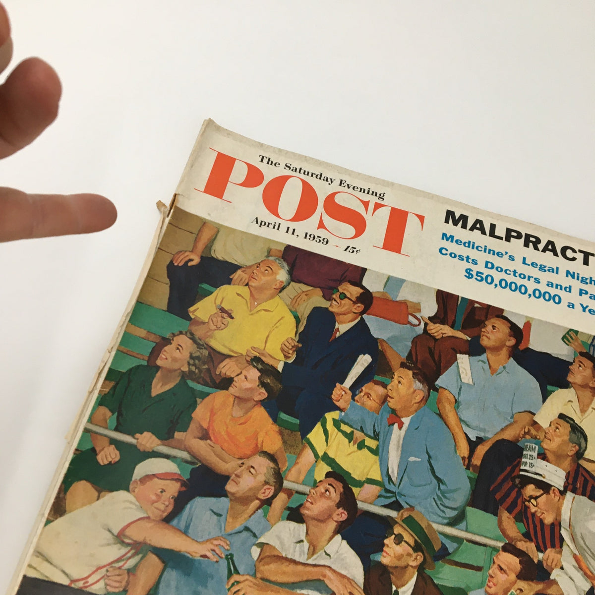 Detailed view of The Saturday Evening Post April 11 1959 magazine cover, showcasing vibrant colors and a captivated audience at a baseball game, related to the 'Malpractice in Medicine' feature.