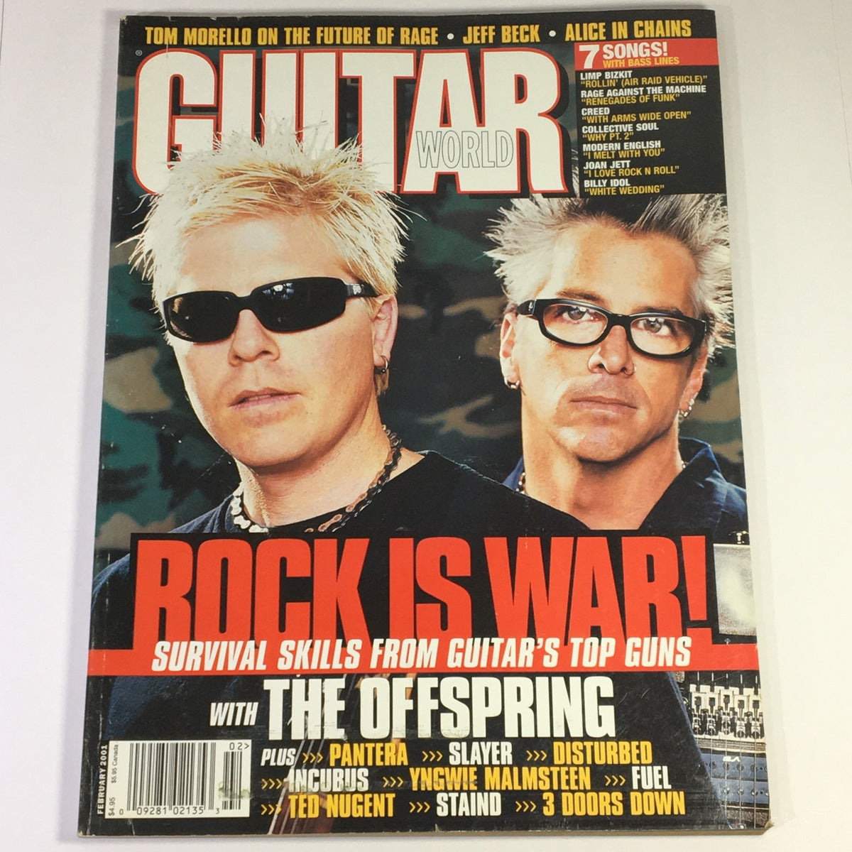 Guitar World magazine cover from February 2001 featuring The Offspring, Jeff Beck, Tom Morello, and Ted Nugent with the headline 'Rock is War!' showcasing survival skills from guitar's top guns.