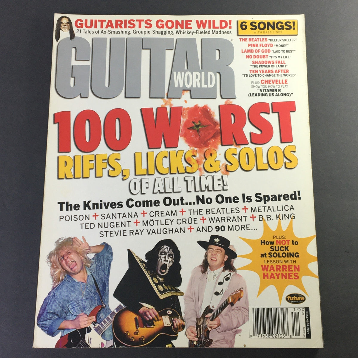 Cover of Guitar World Magazine December 2004 featuring Poison, Santana, Cream, and The Beatles with the headline '100 Worst Riffs, Licks & Solos of All Time'.