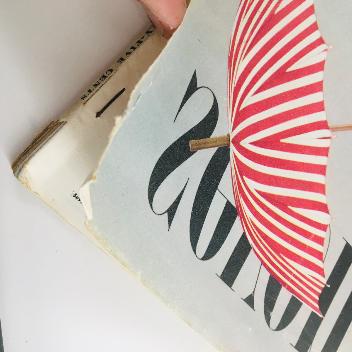 Cover detail of Seventeen Magazine July 1949 featuring a vintage red and white striped umbrella, representing summertime charm.