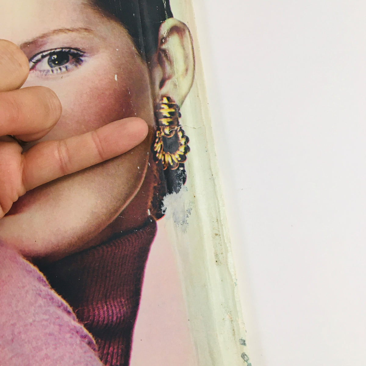 Cover detail of Seventeen Magazine April 1971 featuring a model with earrings and a hand gesture, highlighting the fashion style of the 1970s.