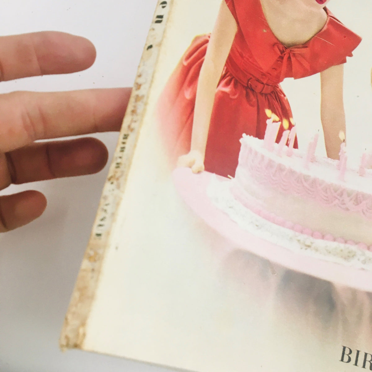 Seventeen Magazine September 1949 featuring a young girl in a red bouffant party dress holding a birthday cake with candles, showcasing vintage fashion.