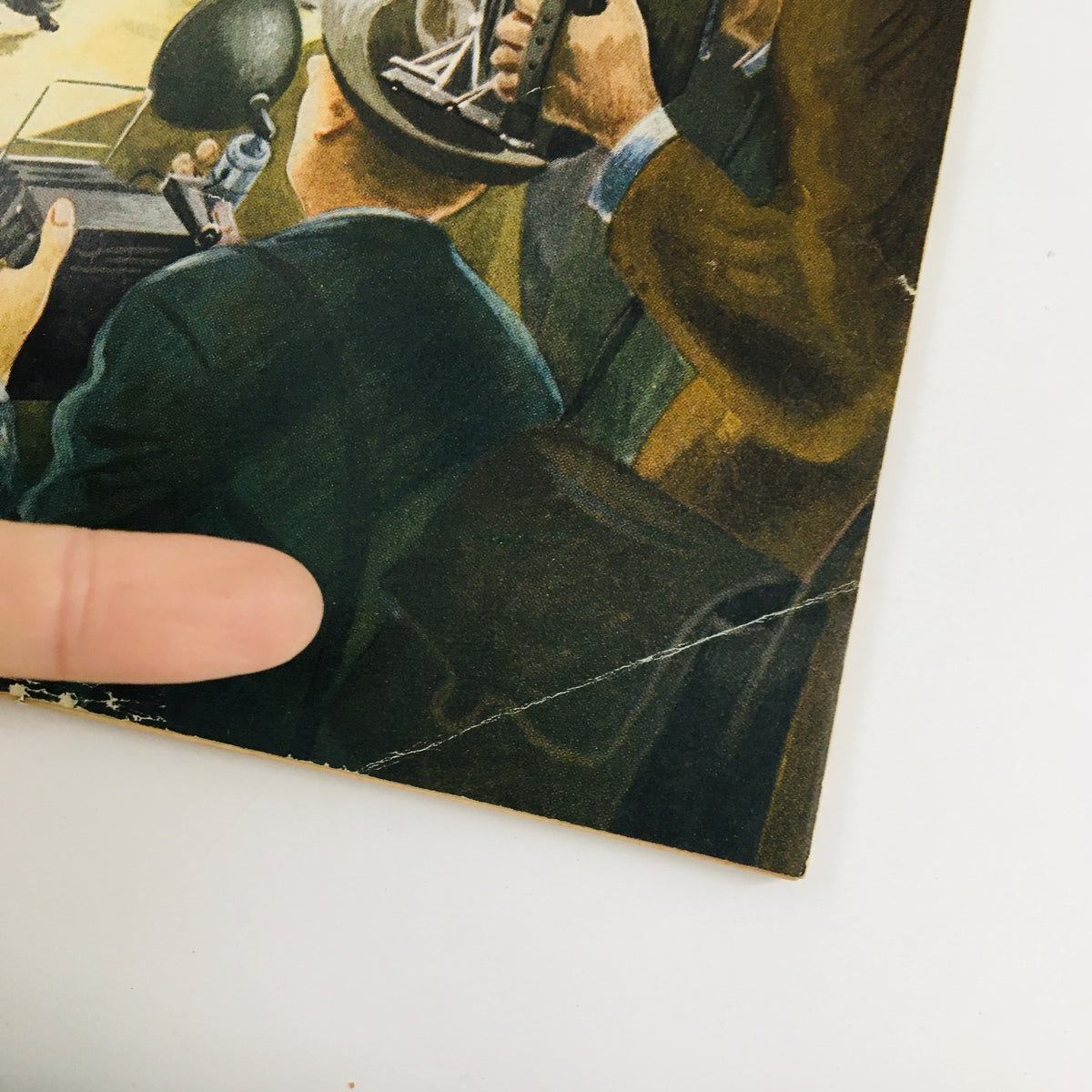 Close-up view of The New Yorker Magazine February 9 1952 cover highlighting the detail of photographer's equipment and a man's hat, showcasing the artistic style of Constantin Alajalov.