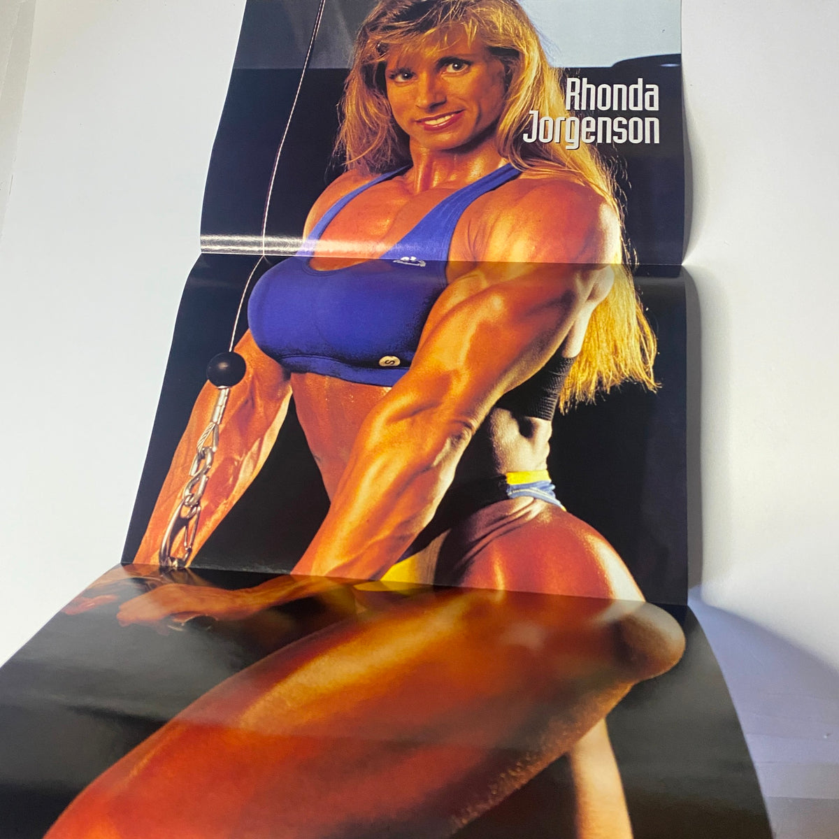 Poster featuring Rhonda Jorgenson from Muscular Development Magazine January 1995, highlighting her muscular physique and fitness expertise.