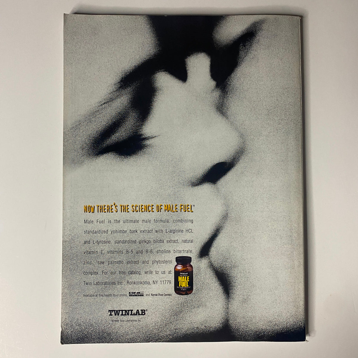 Back cover of Muscular Development Magazine December 1996 advertising TwinLab's Male Fuel product with artistic design.