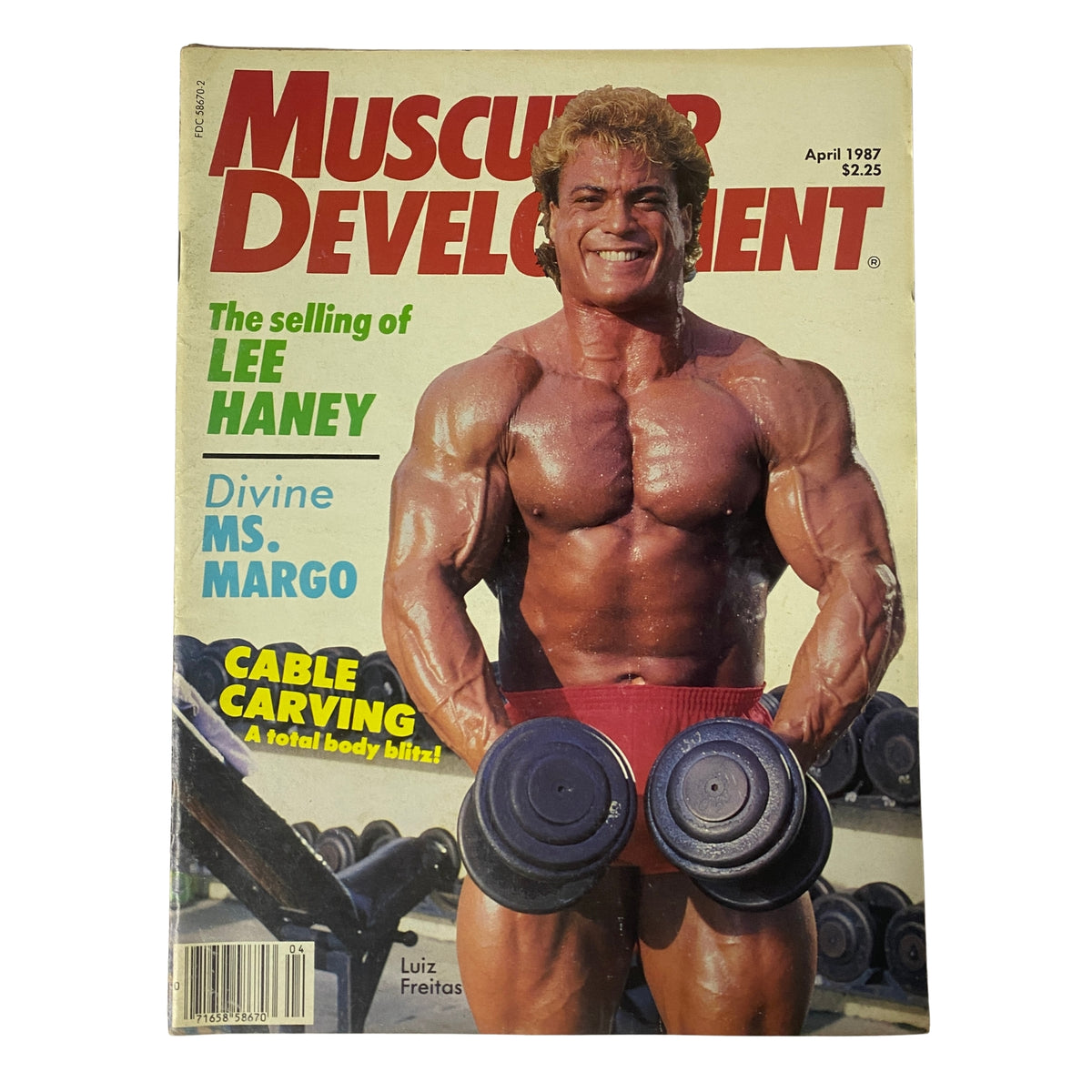 Cover of Muscular Development Magazine April 1987 featuring world-class bodybuilder Lee Haney and Luiz Freitas, highlighting articles on bodybuilding training and philosophy.