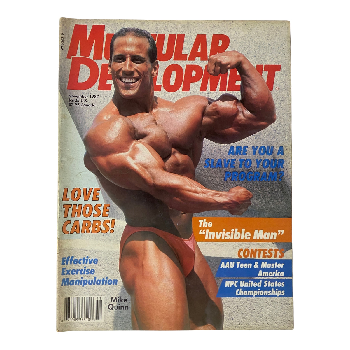 Cover of Muscular Development Magazine, November 1987 featuring Mike Quinn in a flexing pose with the headline 'Love Those Carbs!' and the topic 'The Invisible Man'. Perfect for bodybuilding enthusiasts and collectors.
