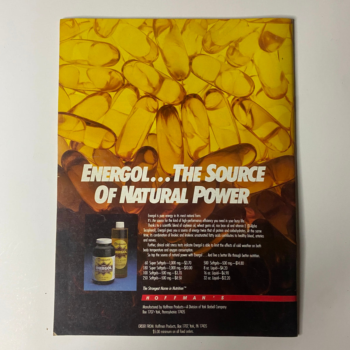 Back cover of Muscular Development Magazine December 1987 advertising 'Energol...The Source of Natural Power'. This image underscores the magazine's focus on fitness and health supplements relevant to bodybuilding.