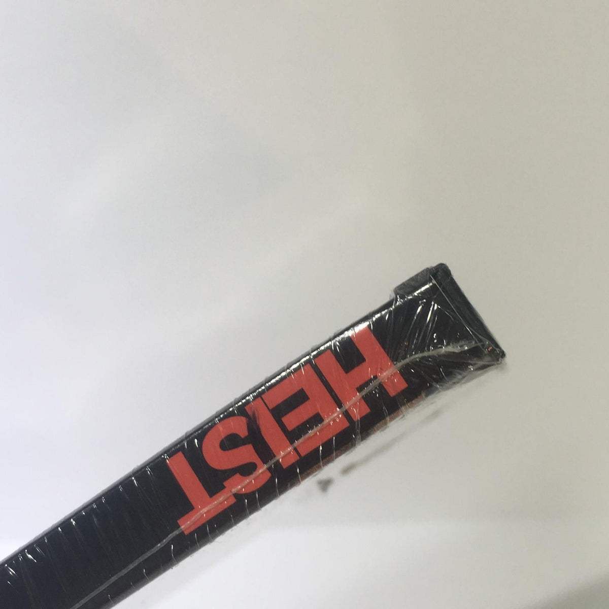 Side view of Heist DVD displaying the title 'HEIST' in bold red letters on a black background.