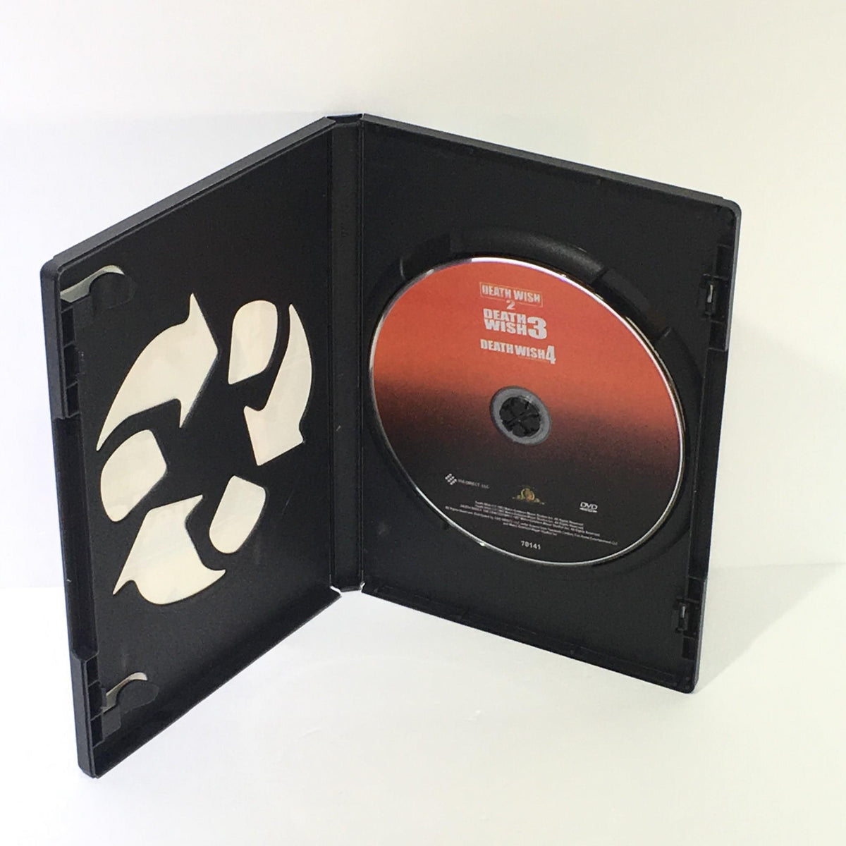 Inside view of the Death Wish 3 DVD, featuring the disc for Death Wish 3 and Death Wish 4, part of the Charles Bronson three-pack collection.