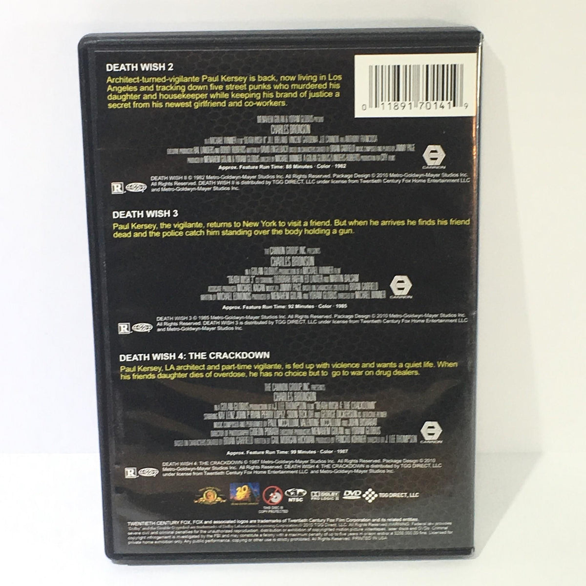Back cover of the Death Wish 2, 3, and 4 DVD, highlighting the movie descriptions and ratings for each film starring Charles Bronson.