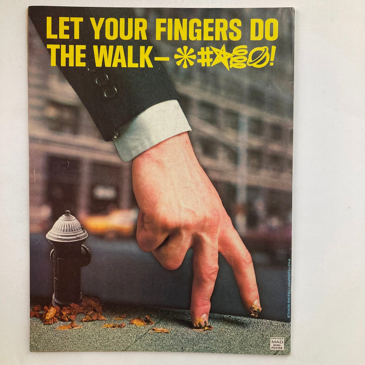 Back cover of Mad Magazine July 1976 No. 184, with a creative and humorous depiction of a hand making a funny gesture, typical of the magazine's comedic style.