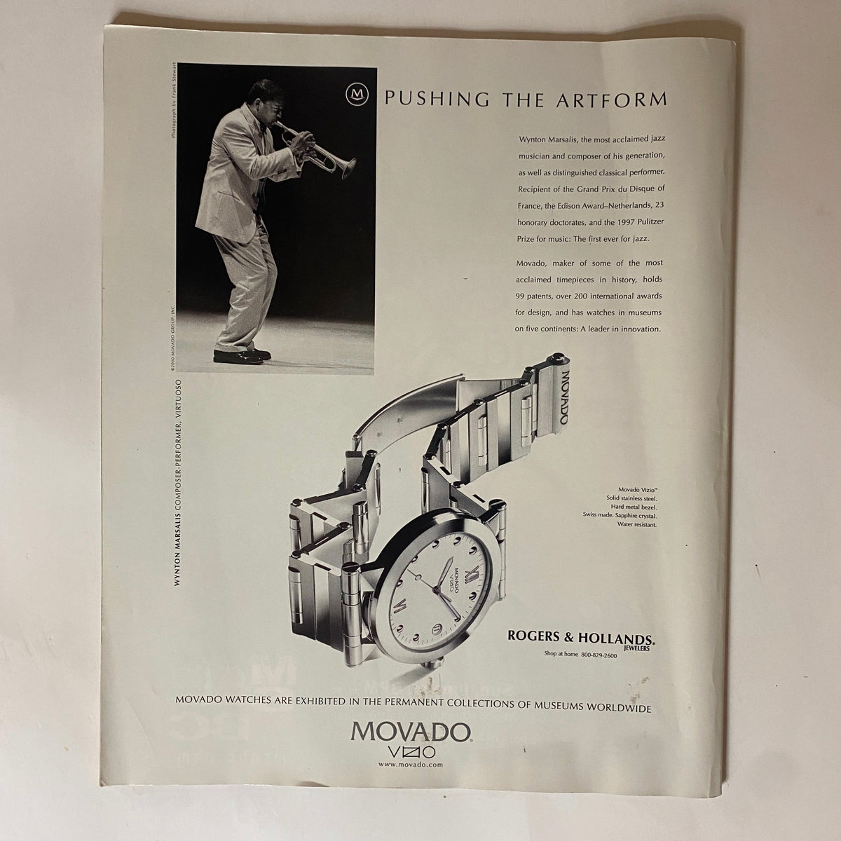 Advertisement from George Magazine June 2000 for Movado watches, showcasing a timeless design and jazz musician Wynton Marsalis. This ad represents the magazine's blend of luxury and culture.