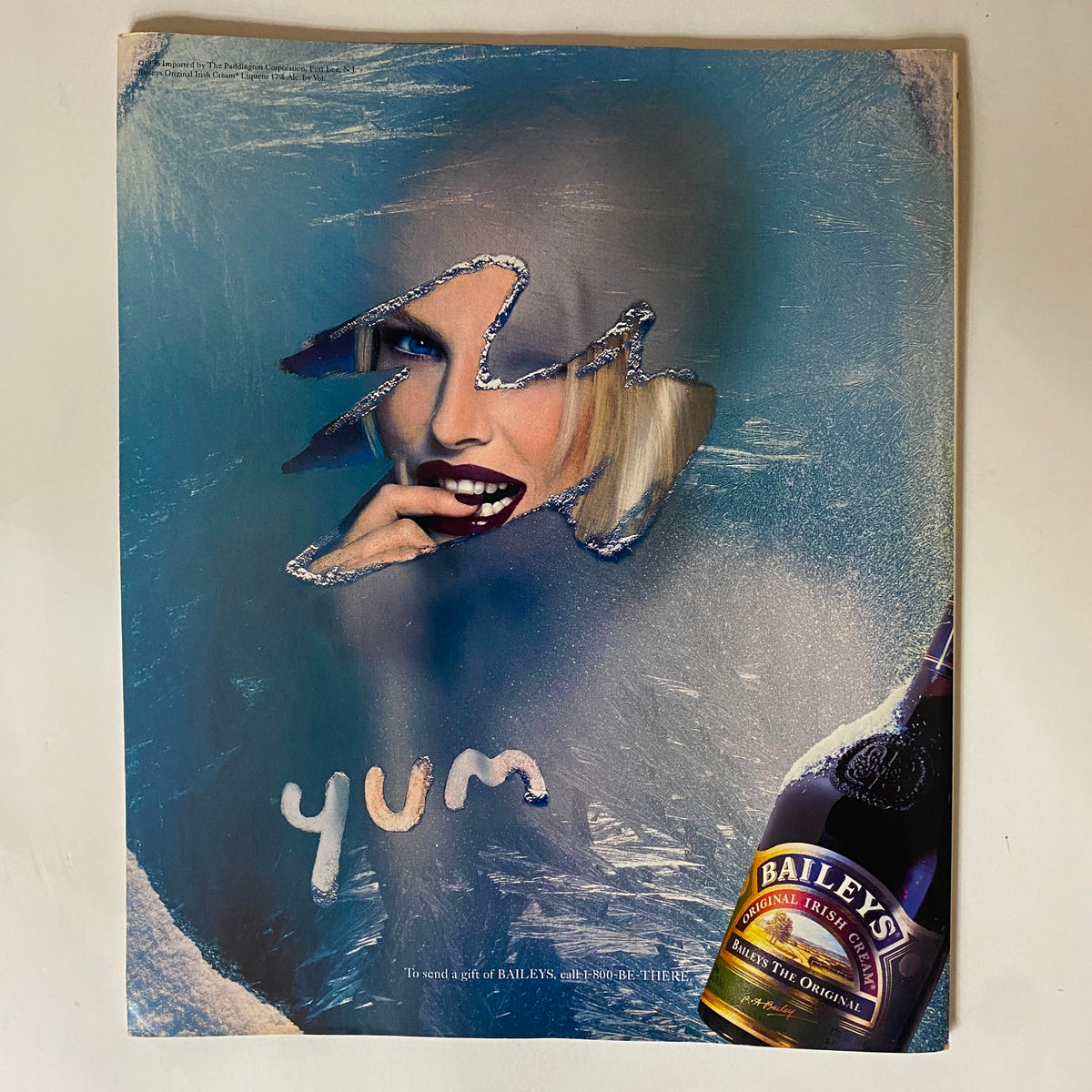 A striking advertisement from George Magazine February 1997 featuring a model with dramatic makeup and a playful design promoting Baileys Irish Cream.