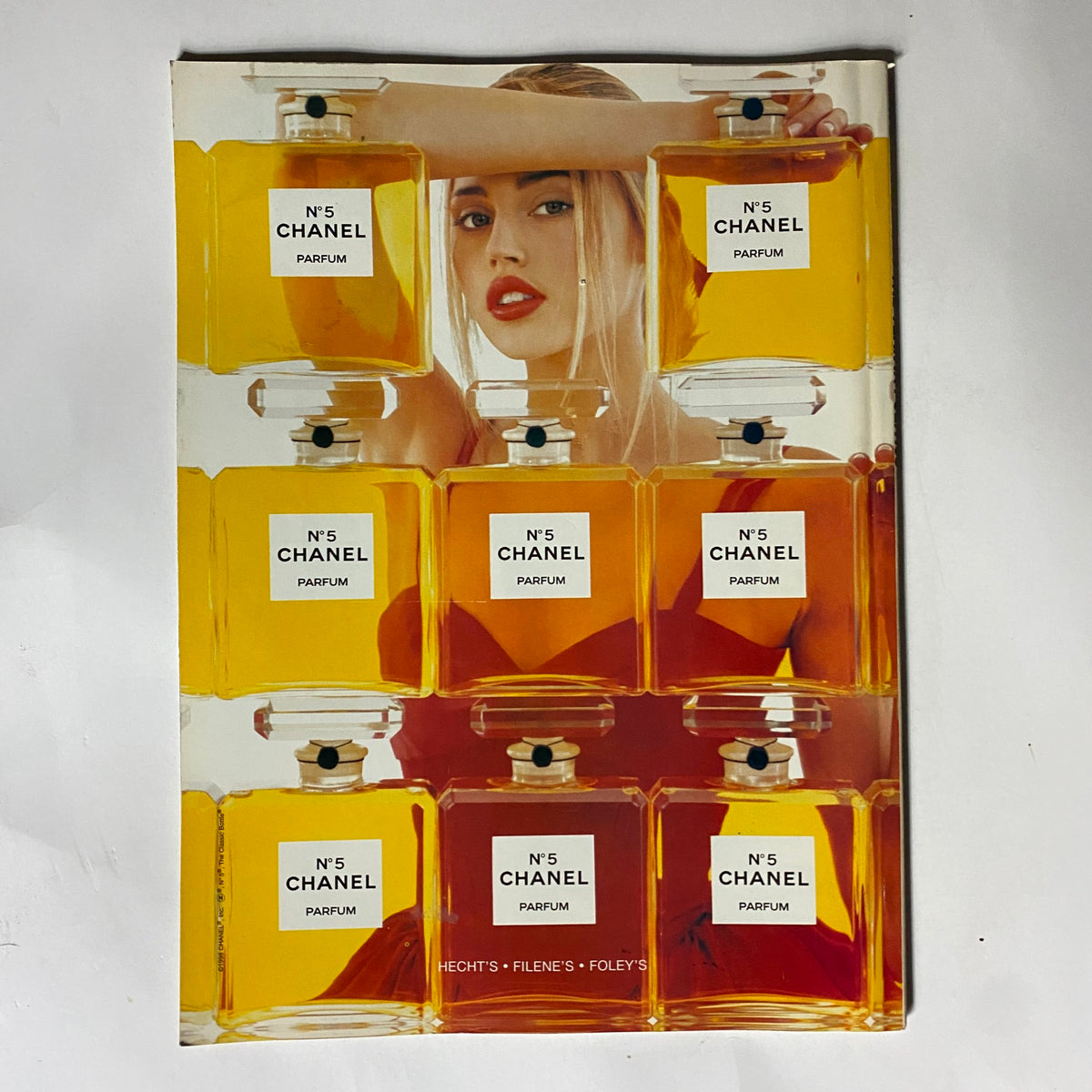 Advertisement for Chanel No. 5 parfum featuring stylized bottles and model, presented in George Magazine January 1999, capturing fashion and beauty trends of the era.