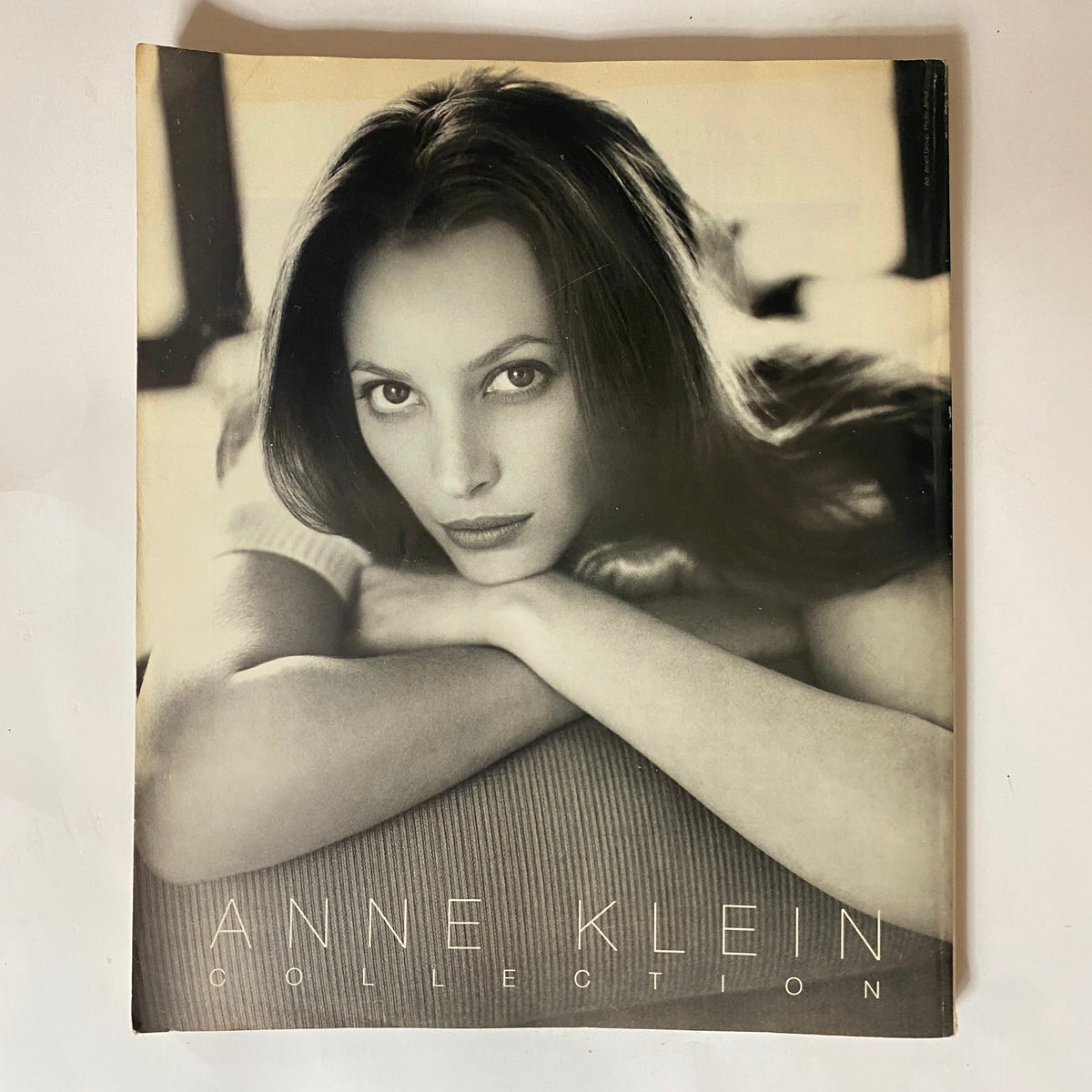 Cover of an Anne Klein collection magazine featuring a model in a black and white portrait style.