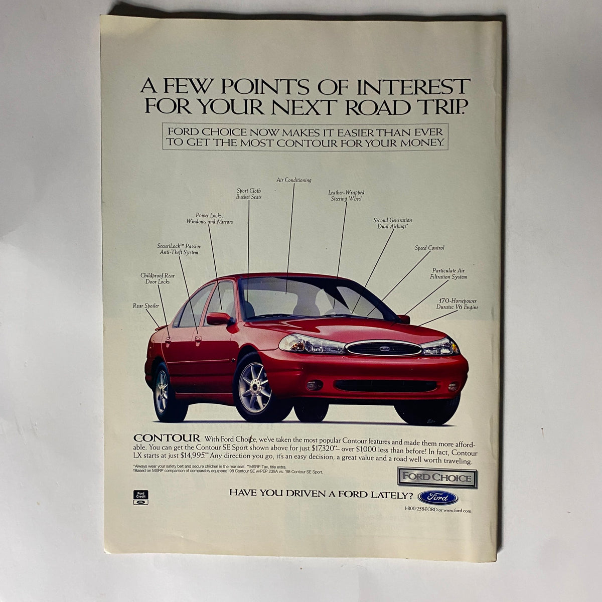 Advertisement from George Magazine February 1998 for Ford Contour, illustrating the car's features and appealing to readers interested in automotive options.