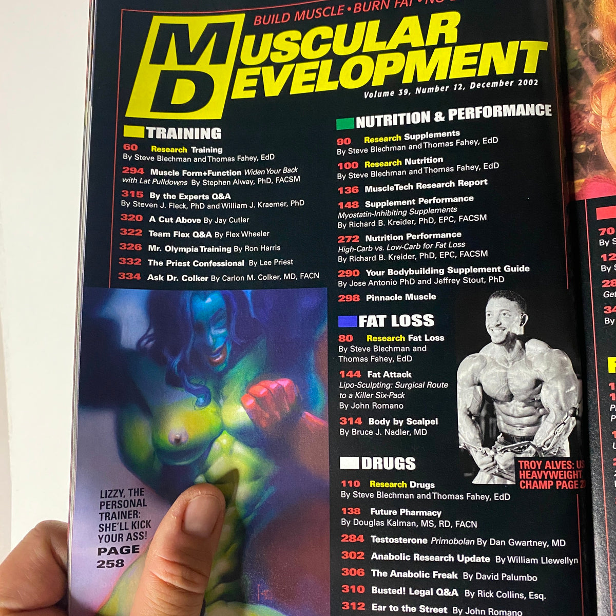 Inside page of Muscular Development Magazine December 2002 displaying the Table of Contents with sections on training, nutrition, and notable features.