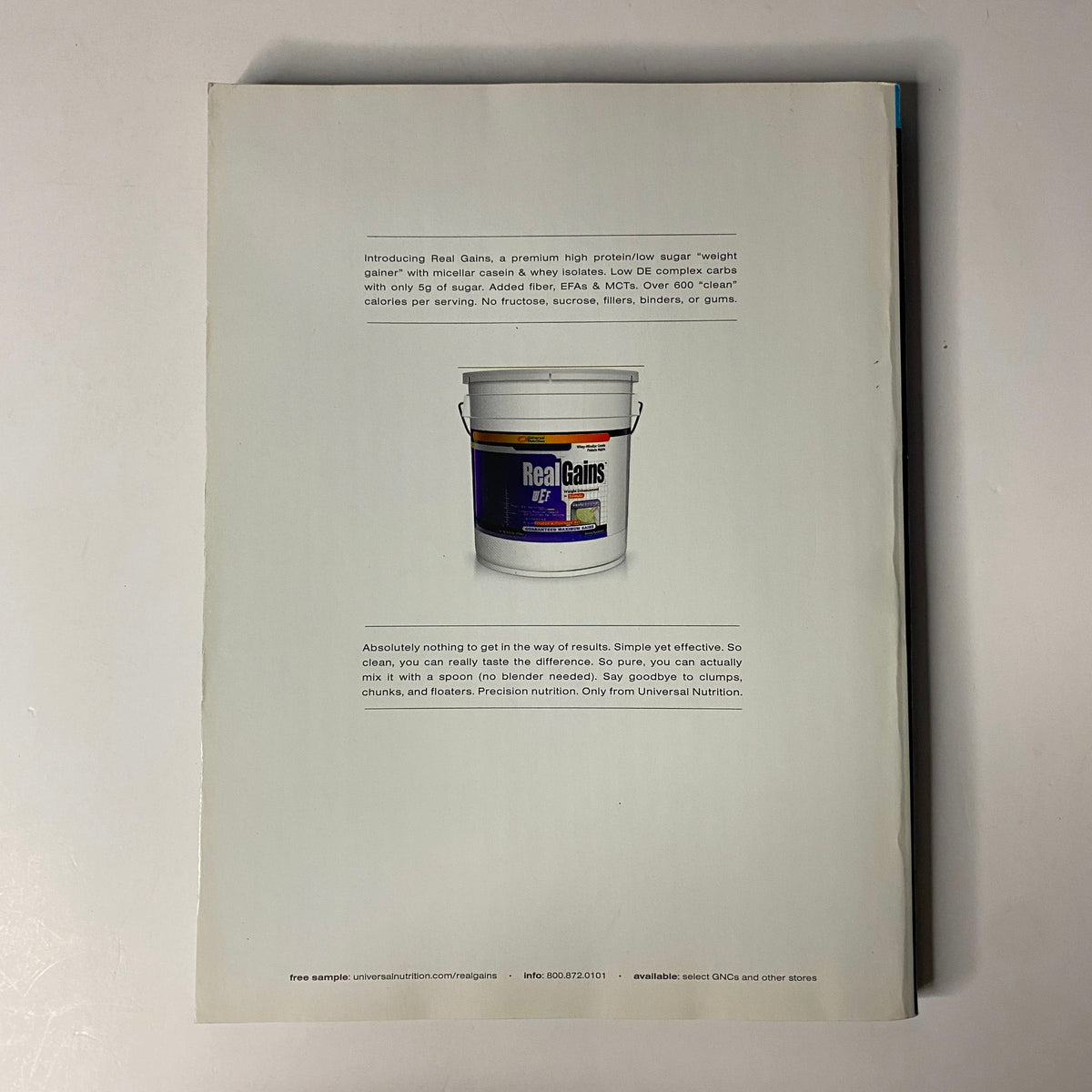 Back cover of Muscular Development Magazine December 2004 Vol. 41 No. 12 featuring a product advertisement for Real Gains, promoting muscle building and weight gain supplements.