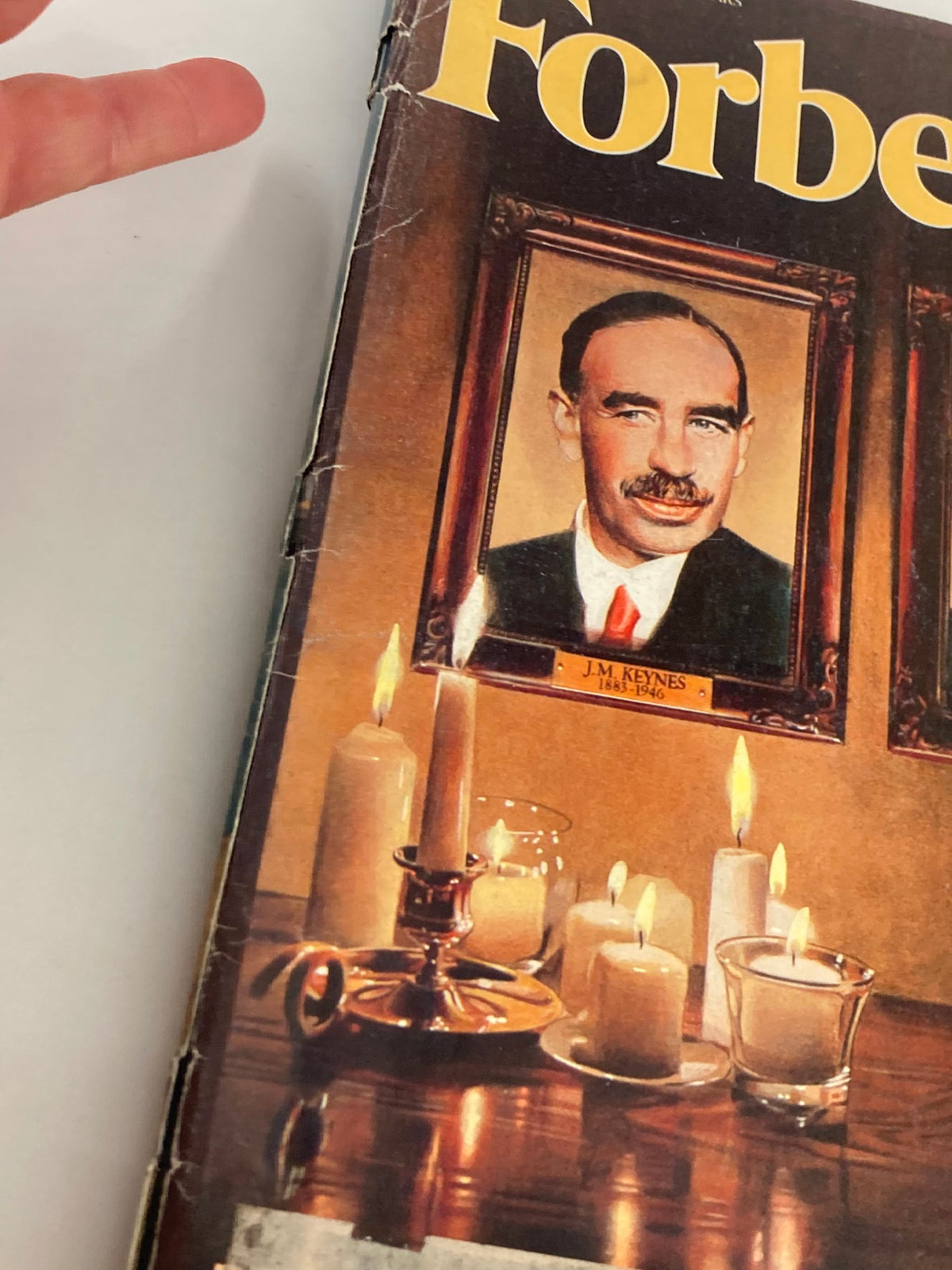 Close-up of the VTG Forbes Magazine May 23, 1983 cover, highlighting the portrait of J.M. Keynes with surrounding candles.