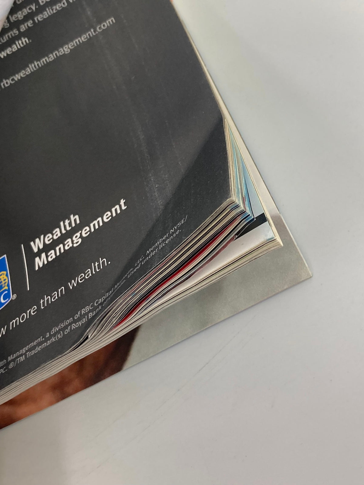 Side view of the pages of Forbes Magazine, dated September 28, 2017, showing the magazine's spine with multiple colored page edges, indicating the magazine's condition.