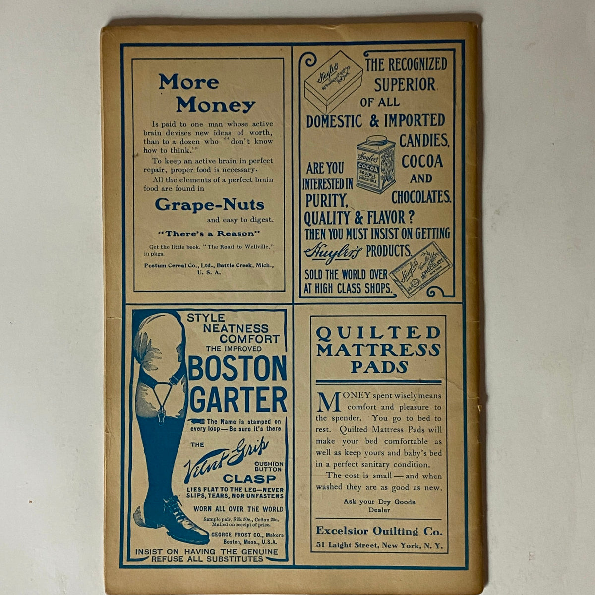Back cover of The Black Cat Magazine, October 1908, displaying advertisements for products like Grape-Nuts and Boston Garter, highlighting early 20th-century design.