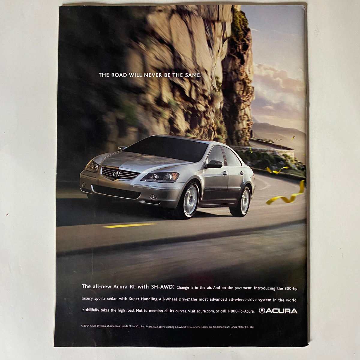 Tennis Magazine November December 2004 Jennifer Capriati Cover Advertisement for the Acura RL, emphasizing all-wheel drive and luxury features with a scenic backdrop.