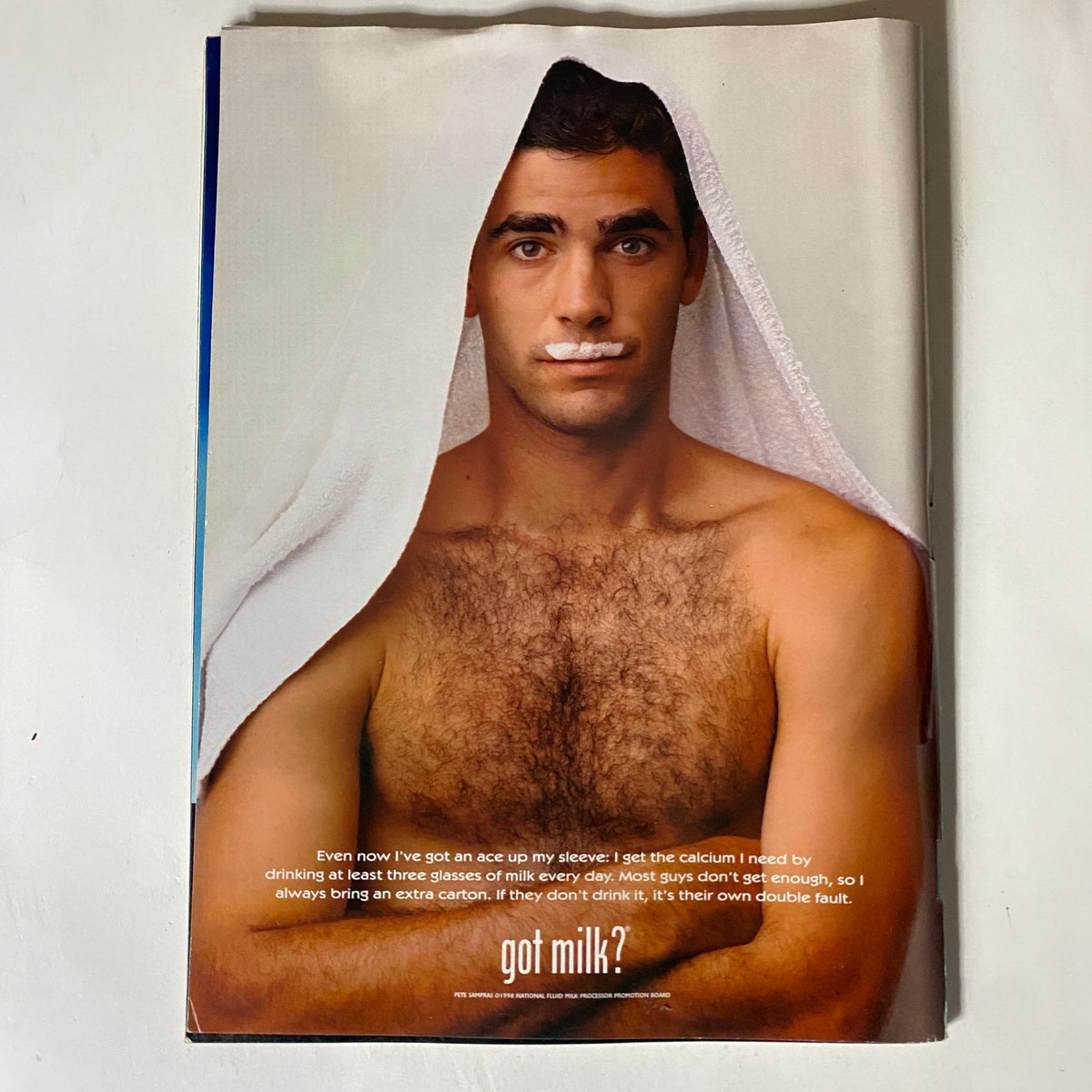 Tennis Magazine March 1999 cover featuring Andre Agassi, showcasing an iconic image of the tennis star promoting milk with the tagline 'got milk?'. This vintage magazine captures a moment in tennis history and highlights Agassi's influence in sports culture.
