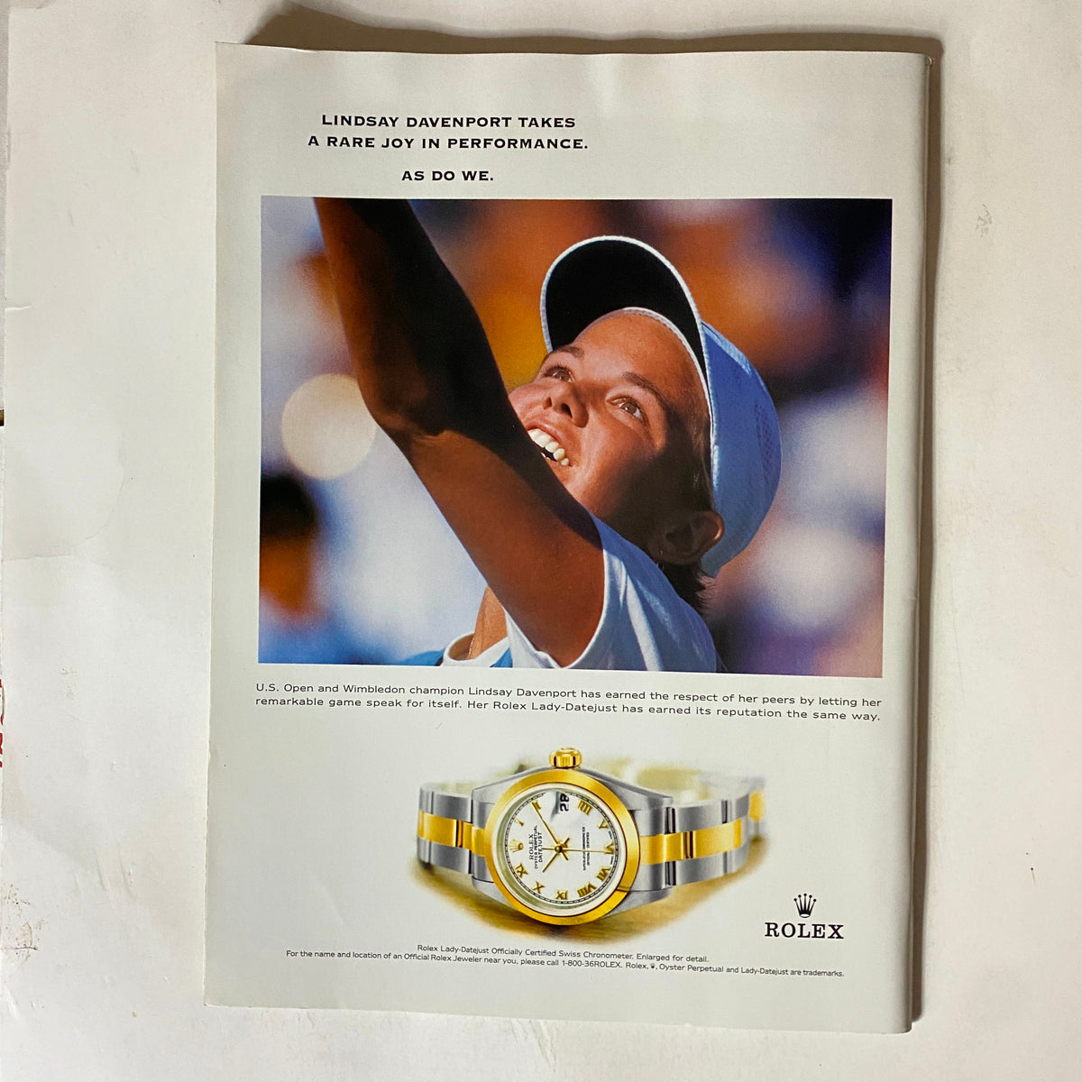 Advertisement from Tennis Magazine May 2000 showcasing Lindsay Davenport, a U.S. Open and Wimbledon champion, promoting a Rolex watch.