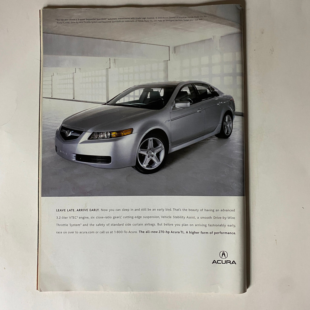 Back cover of Tennis Magazine January February 2004 showcasing an advertisement for Acura with a sleek silver car.