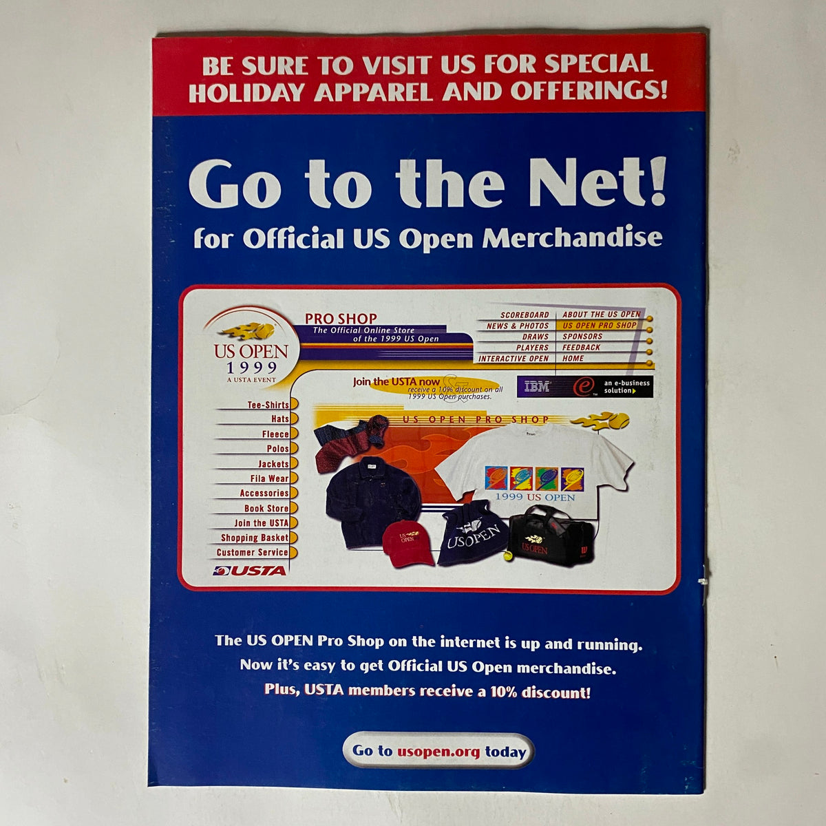 Go to the Net! Advertisement for Official US Open Merchandise featuring various US Open items including apparel and accessories, from the USTA Tennis Magazine December 1999 issue with Andre Agassi on the cover.