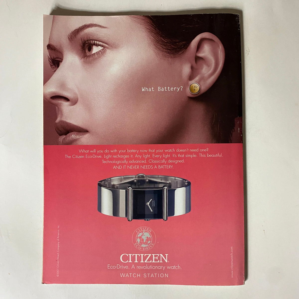 Back cover of Tennis Magazine April 2001 displaying a Citizen EcoDrive advertisement featuring a woman wearing stylish accessories, promoting technology and elegance.