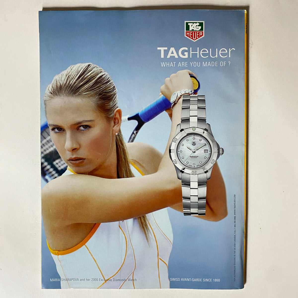 Advertisement in Tennis Magazine June 2005 showcasing a TAG Heuer watch with Maria Sharapova, enhancing the magazine's appeal to tennis and luxury sports fans.