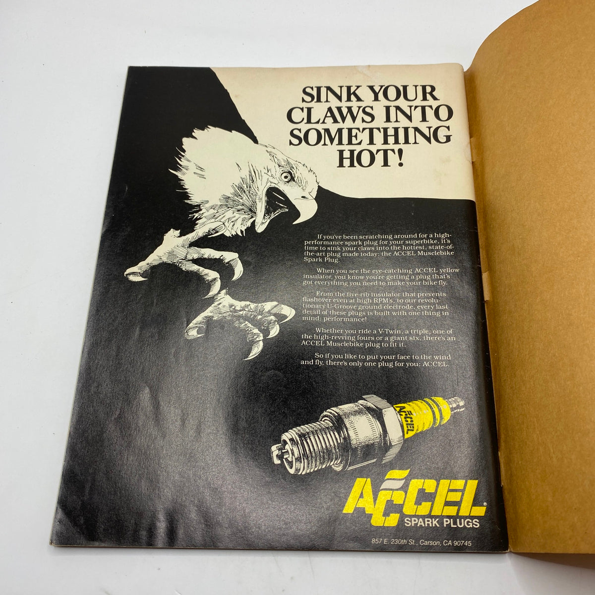 Inside advertisement page from VTG Easyriders Magazine April 1983 promoting ACCEL spark plugs, with an eye-catching eagle illustration.