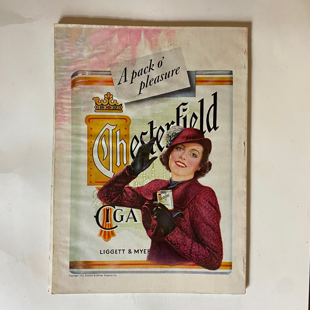 Cover advertisement for Chesterfield cigarettes in VTG The American Magazine November 1937, featuring a woman in a fashionable outfit promoting the brand.