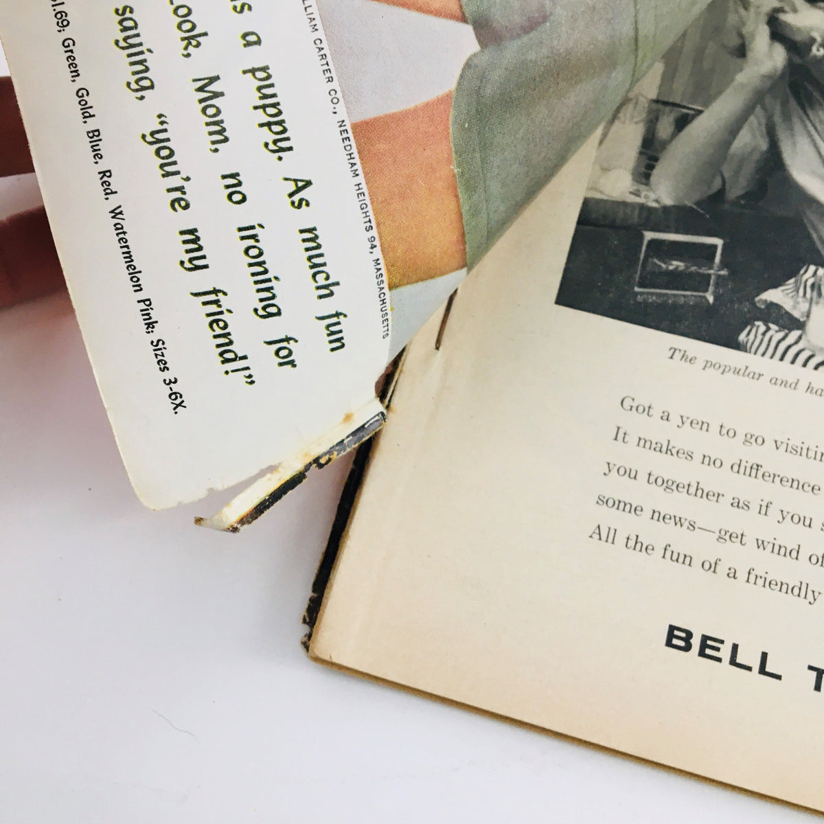 Inside view of Redbook Magazine May 1961 showing damaged spine and pages. This vintage issue contains articles related to lifestyle and celebrity culture from the 1960s.