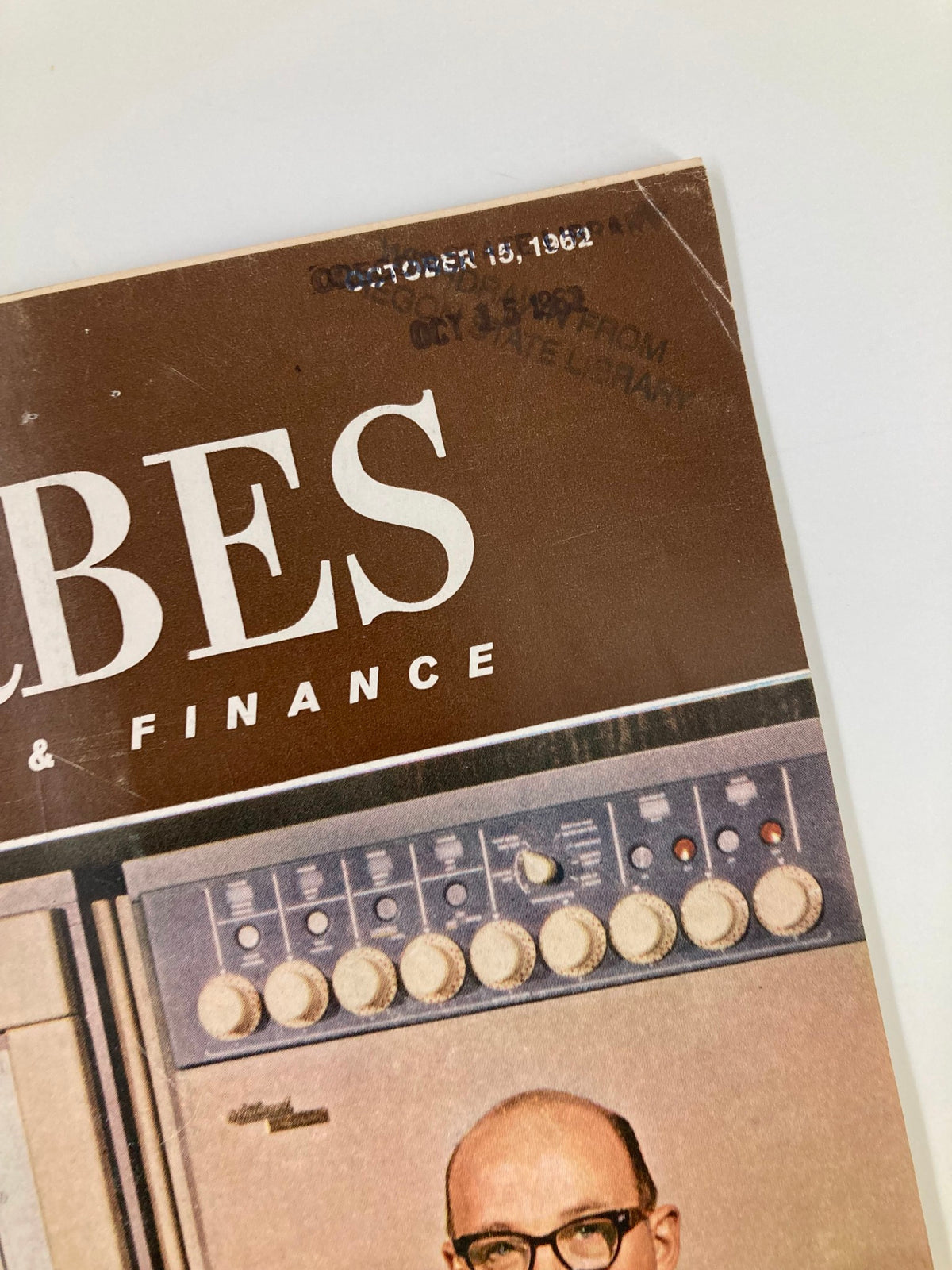 Close-up view of the Vintage Forbes Magazine October 15 1962, highlighting the publication date and details related to National Cash Register's Robert Oelman.