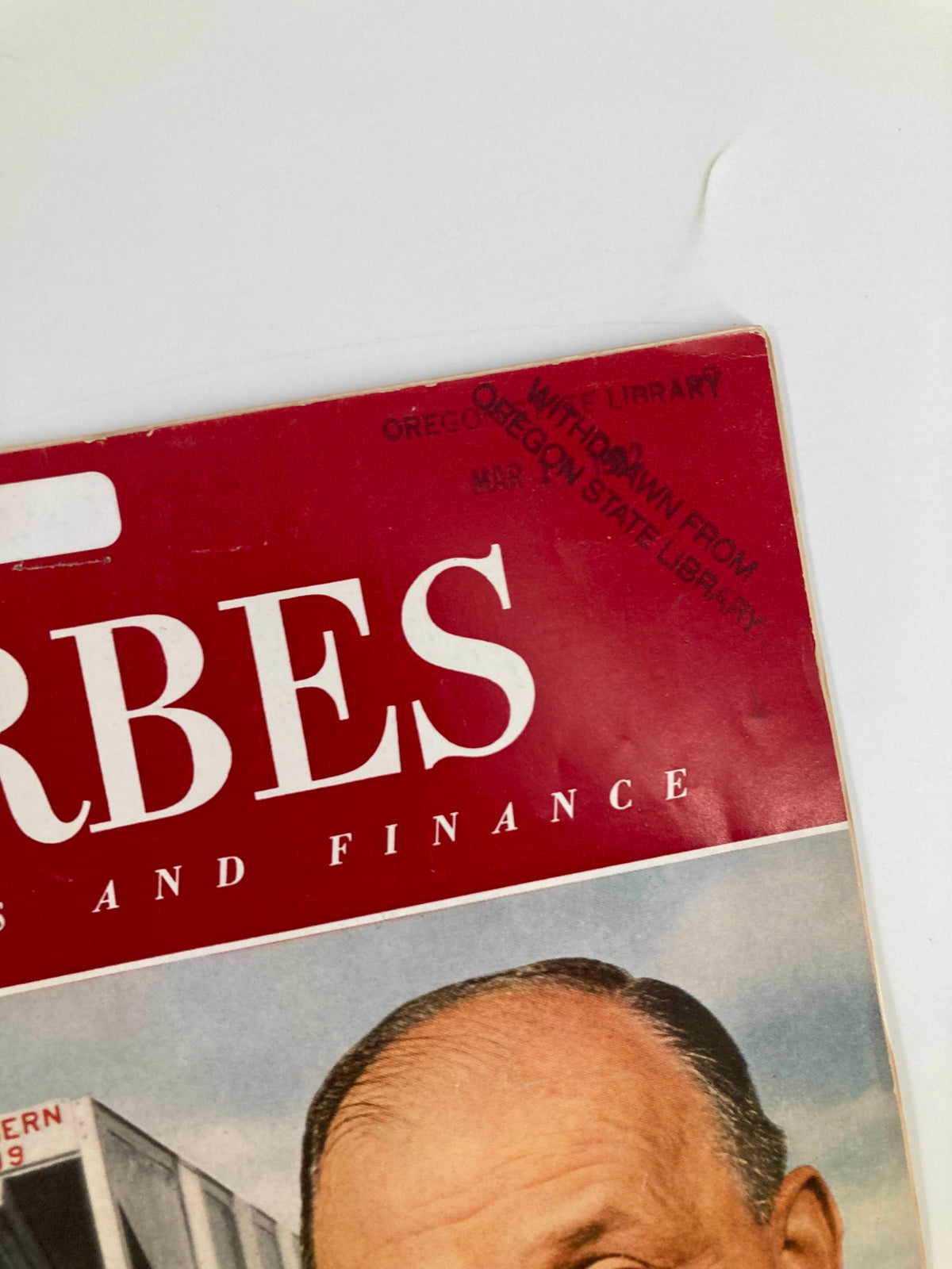 Top corner of VTG Forbes Magazine March 15 1962 displaying library withdrawal stamp, indicating its history and previous circulation.