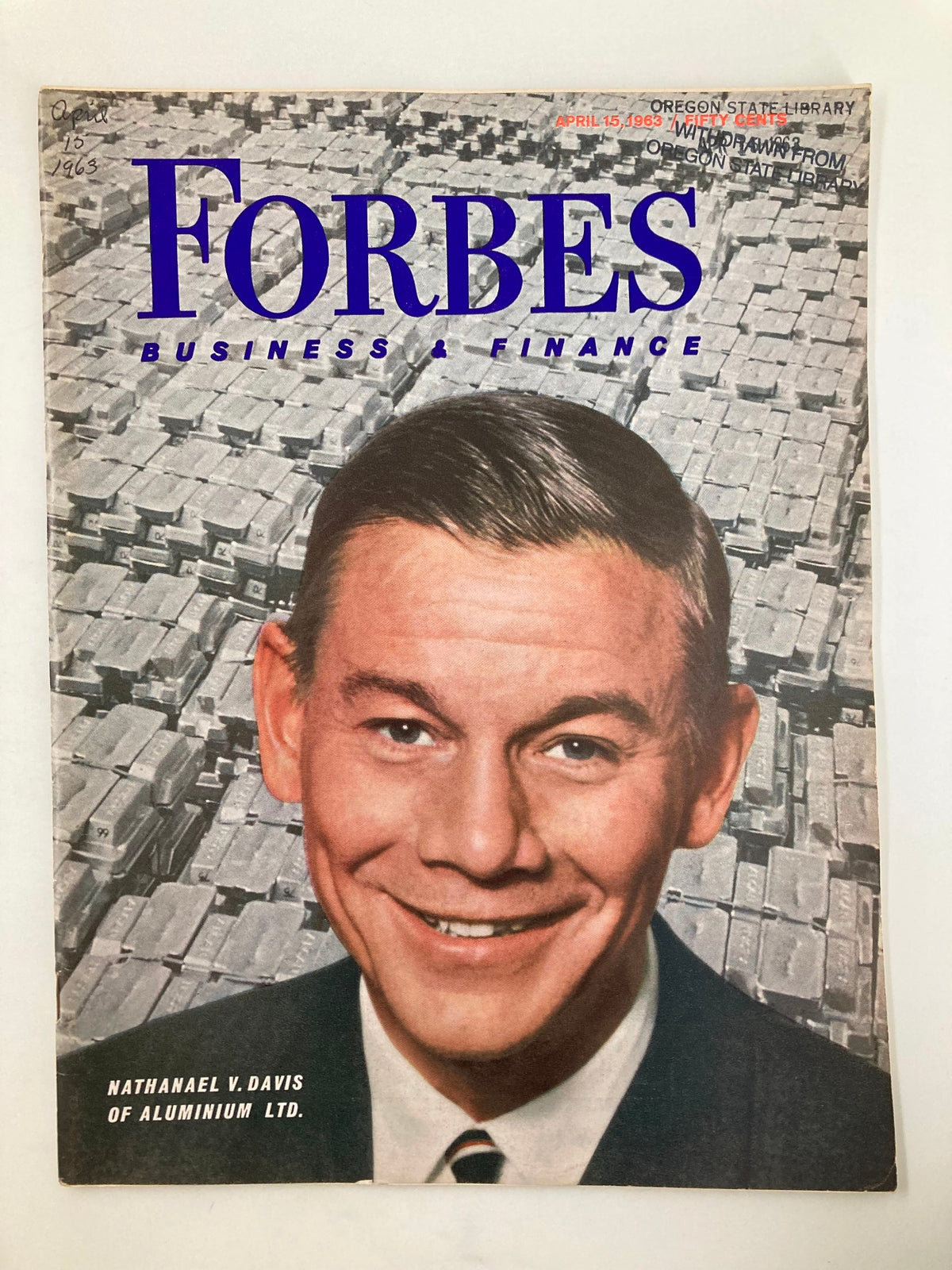 VTG Forbes Magazine April 15 1963 featuring a prominent cover photo of Nathanael V. Davis of Aluminum Ltd. with a backdrop of aluminum ingots.