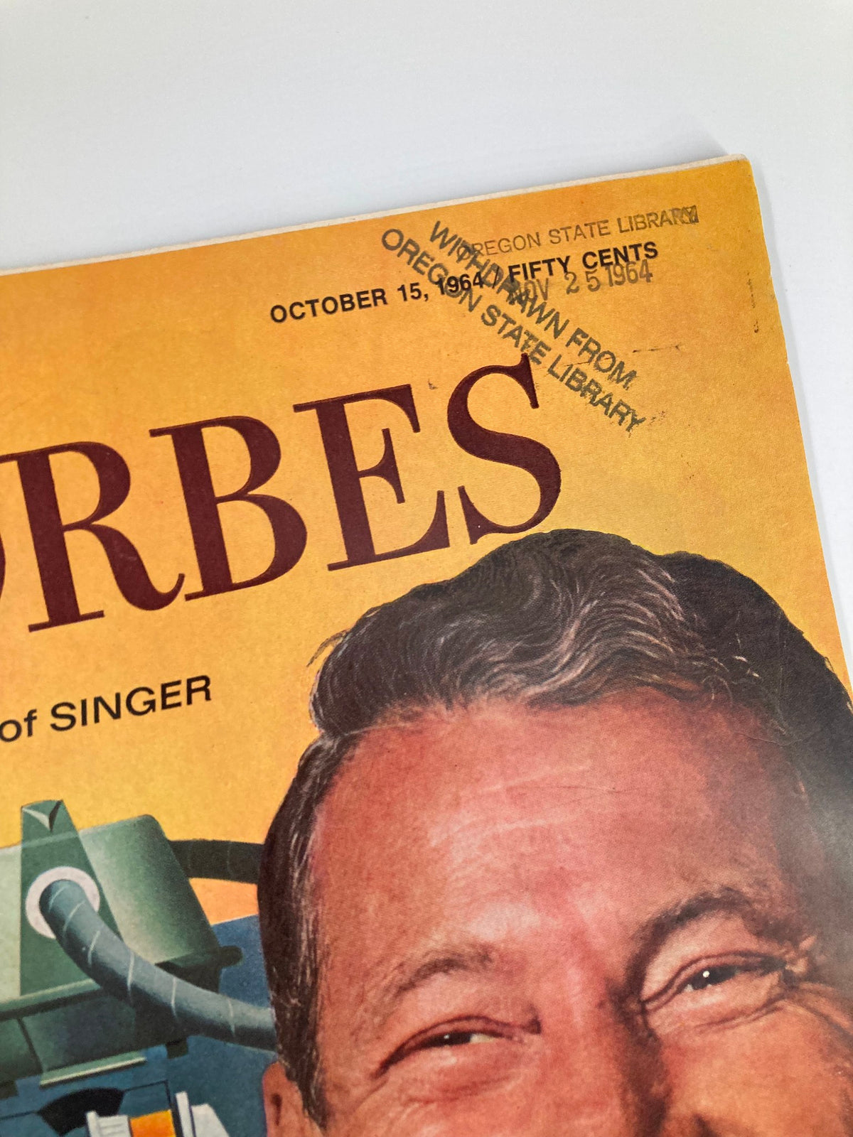 Close-up of the cover of Vintage Forbes Magazine dated October 15, 1964 featuring Donald P. Kircher of Singer, highlighting the magazine's title and library stamp.